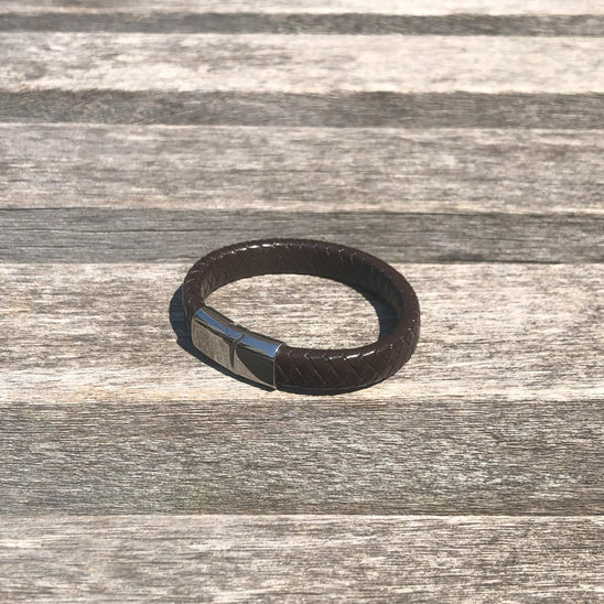 Black fitness tracker on a wooden surface