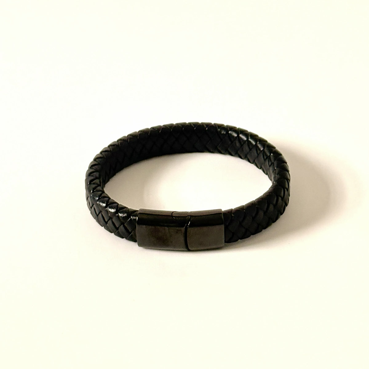 Men’s black braided leather bracelet with gunmetal clasp front view
