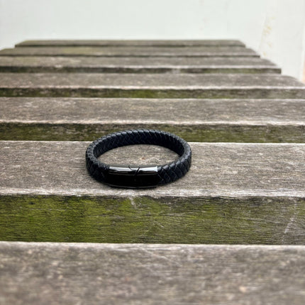 Men’s black braided leather bracelet with gunmetal clasp front view