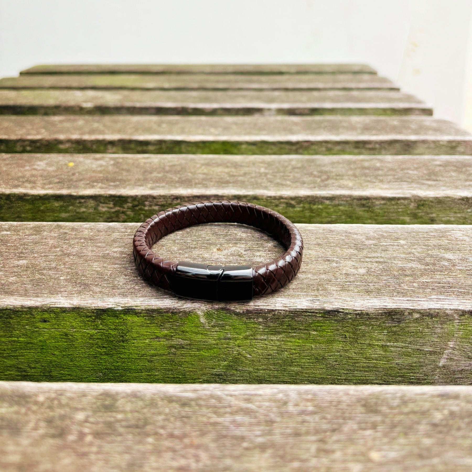 Men’s brown braided leather bracelet with gunmetal clasp front view