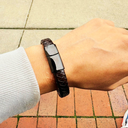 Men’s brown braided leather bracelet worn on wrist