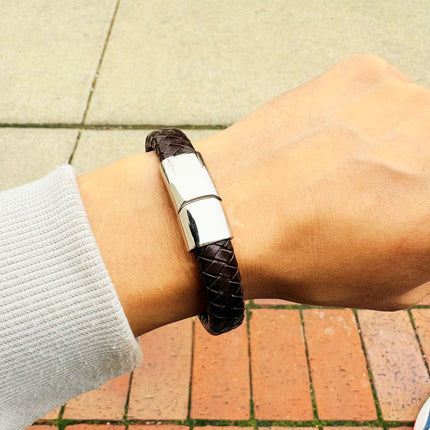 Men’s brown braided leather bracelet worn on wrist