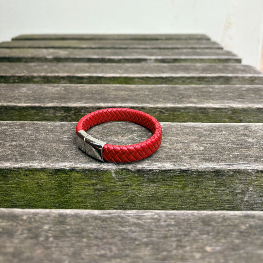 Men’s red braided leather bracelet with polished stainless steel clasp angled view