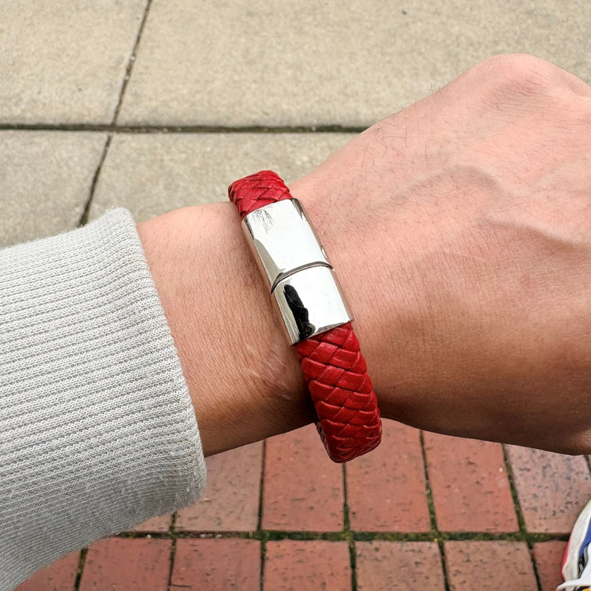 Men’s red braided leather bracelet worn on wrist